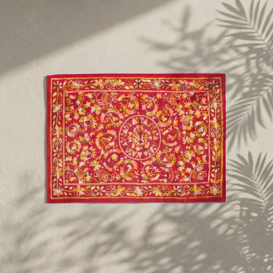 Red Nakshi Kantha throw with a central medallion and decorative stitched borders